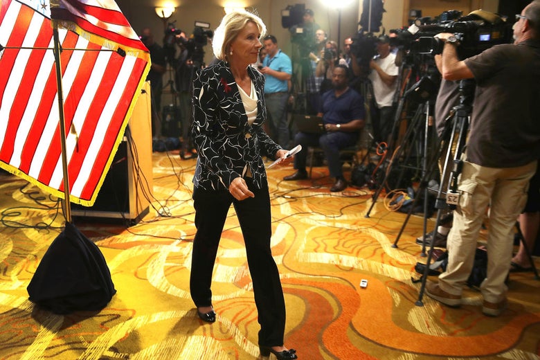 Betsy DeVos leaves a press conference that was held at a hotel near Marjory Stoneman Douglas High School in Parkland, Florida on Wednesday.
